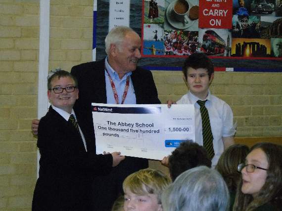 Hedgehogs chairman Bob Hockey, accompanied by fellow Hedgehog Colin Sampson, recently visited The Abbey to present a cheque to the students