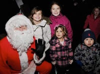 Santa switches on Christmas lights