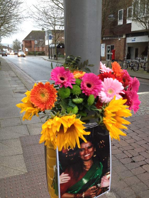 Flowers and a photograph mark the spot where a woman was killed crossing Dragon Street on Tuesday