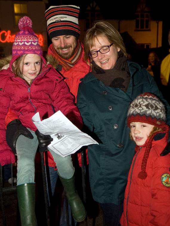A family enjoying the Christmas carols at the switch on of the lights in Beacon Hill on Saturday (Photo: Paul Doyle)