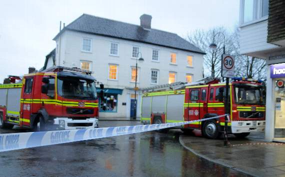 Police tape and fire engines mark the scene of yesterday's tragedy on Dragon Street in which a woman lost her life crossing the road