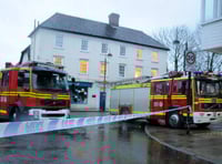 Police tape and fire engines mark the scene of yesterday's tragedy on Dragon Street in which a woman lost her life crossing the road