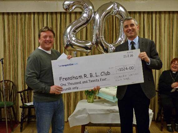 James Stevens (left) collects the RBL cheque from Roger Holmes