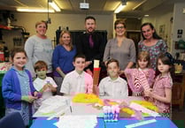 Proud siblings hold a torch for mum
