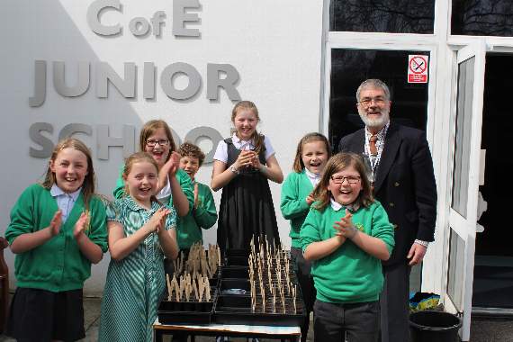 Neil Newitt with pupils planting seeds at Liphook Junior School