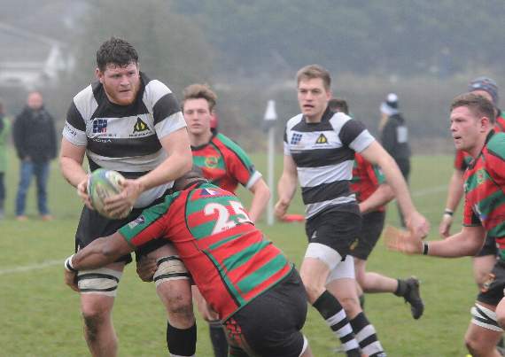 Pete Daly, Farnham’s 20-stone number 8, is a hard man to bring down, as Millbrook discovered to their cost on Saturday.  (Order no FD52-77-16).