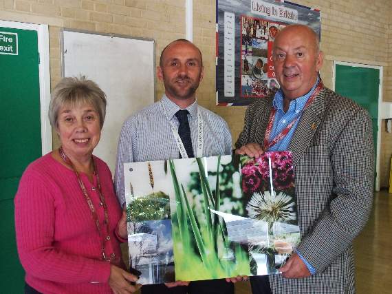 Ann and Gordon Ann Parris from the Children with Special Needs Foundation presented with their award by?Abbey headteacher Nathan Aspinall