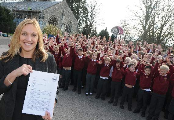 Pupils at St Lawrence Primary School celebrate a “good” Ofsted report with headteacher Dawn Casson. Picture order no: AD11-81-17