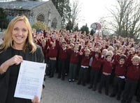Pupils at St Lawrence Primary School celebrate a “good” Ofsted report with headteacher Dawn Casson. Picture order no: AD11-81-17