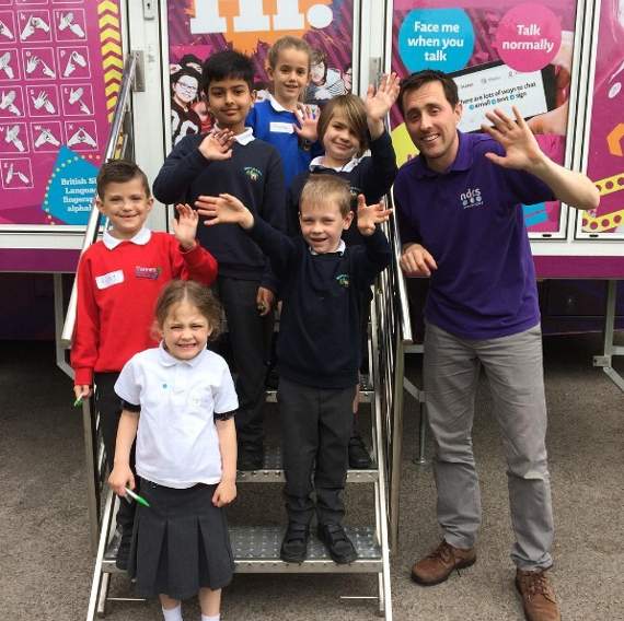 Children from Medstead Primary School with Mark Gill on the National Deaf Children’s Society Roadshow in Medstead