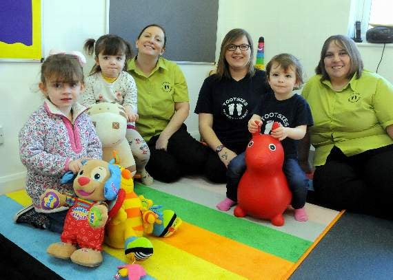 Tootsies staff Jo Fisher, Becca Martin and Kelly Gray with children (BD04-52-17)