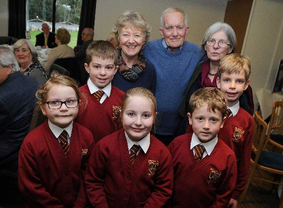 Singers Carolyn Robson and Moira Craig with Chiks’ founder Robin Radley and children from Rowledge School