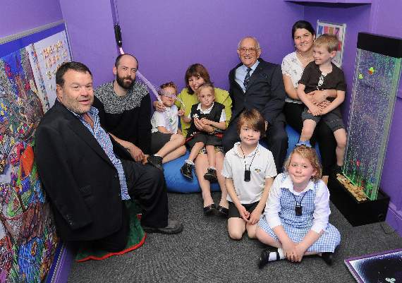 Tom Yendell, who designed and painted the games wall, with David Watkins, headteacher Jane Oborn, Mike Sanders Lucy Bush and children at Medstead Primary School. Picture order no: AD23-06-17