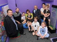 Tom Yendell, who designed and painted the games wall, with David Watkins, headteacher Jane Oborn, Mike Sanders Lucy Bush and children at Medstead Primary School. Picture order no: AD23-06-17