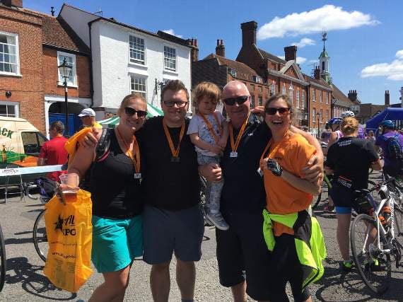 Herald chief reporter Daniel Gee (second from left) and family after completing the 25-mile route