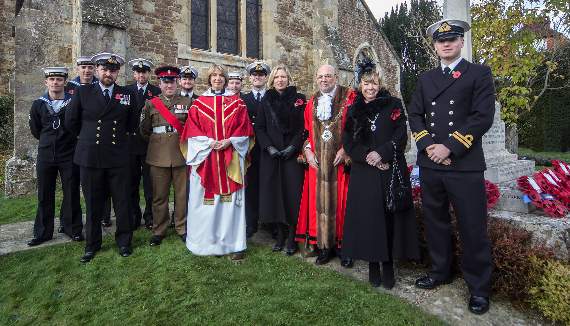 The crew from HMS Chiddingfold at the village Remembrance Sunday service with Rev Sarah Brough