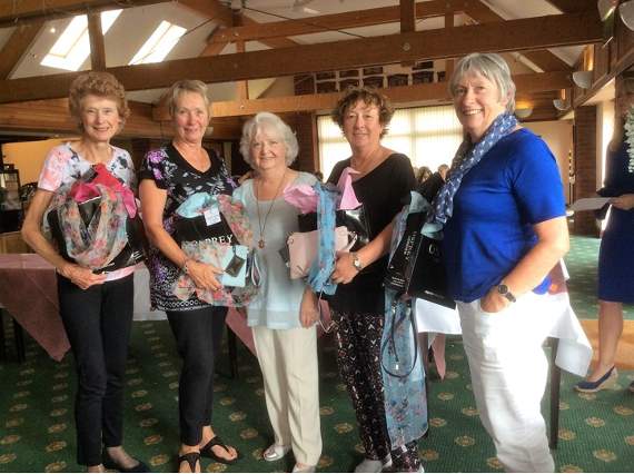 Lady captain Maggie Evans (centre) with the prize-winners.