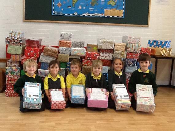 The children from Petersfield Infant School proudly show off their shoeboxes