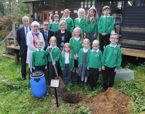 Headteacher Marcella Dobson, school governors and pupils bury the time capsule. Picture order no: BD41-141-17