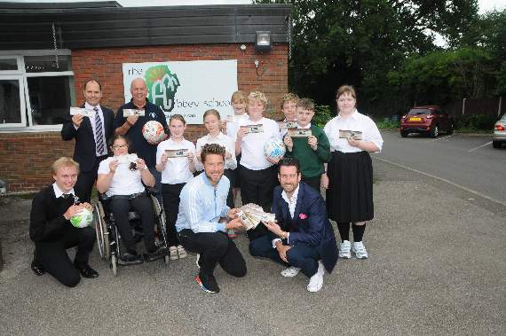 Head Gordon Jackson, with Aldershot captain Callum Reynolds, entertainer Jamie Raven and Gordon Parris of the Children with Special Needs Foundation