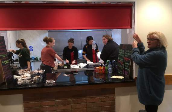 Jane Devonshire pulls the blind to formally open the new kitchen and to pay tribute to all the Alton Rugby Club volunteers who have worked hard to make it a success