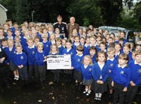 Lord Lieutenant of Hampshire Nigel Atkinson and John Harrap of the National Association of Decorative and Fine Arts Societies with pupils at Selborne Primary School. Picture order no: AD43-91-17