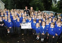 Pupils proudly show off school mosaic