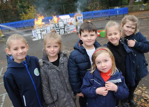 Grayswood pupils watch as their Tudor model of Lodon goes up in flames