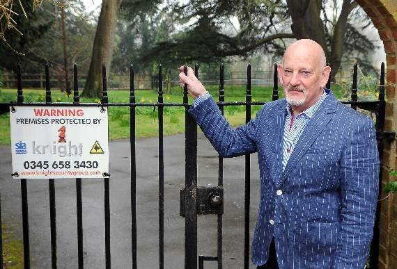 George Hesse outside the gate to Farnham Library’s ‘secret’ garden