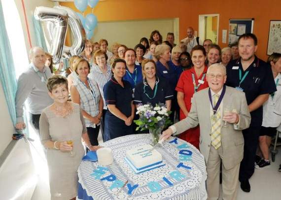 Alton deputy mayor Allan Chick cuts the cake during the party to celebrate the 70th anniversary of the NHS. Picture order no: AD29-01-18
