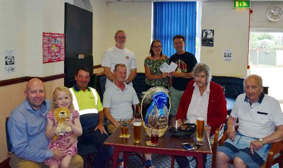 Weyfest’s Richie Ellmer presenting the tickets to Rachel Evans of the Badshot Lea Working Men’s Club