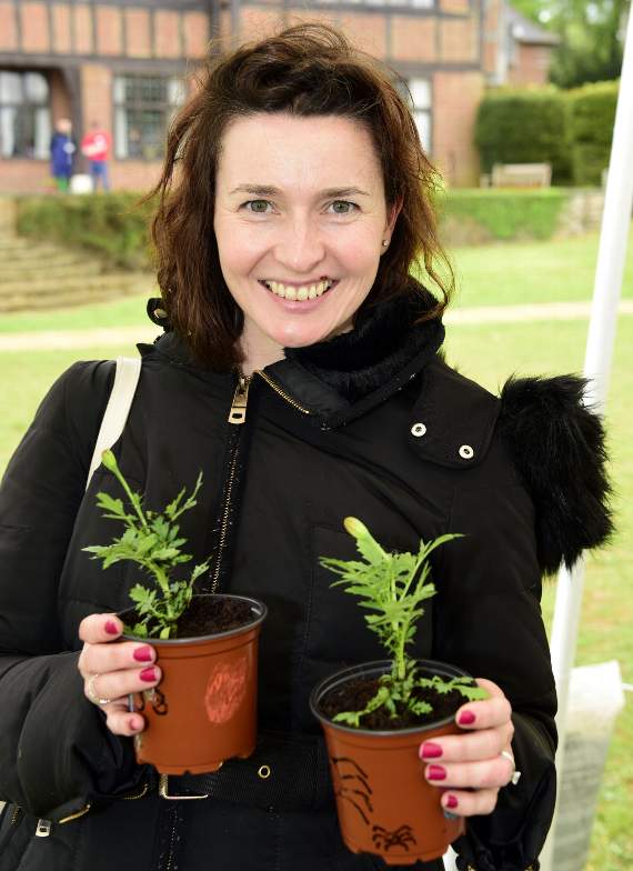 Nicola Clutterbuck with pot plants (HD21-131-18)