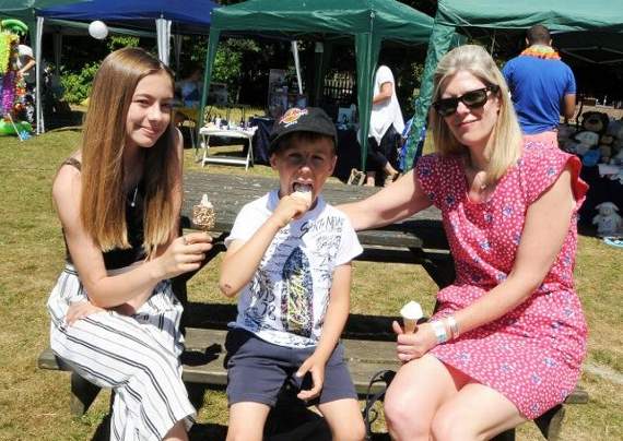 Maisie Kelly, Theo Kelly and Karen Trevenna cool off with an ice cream. Picture order no: AD28-244-18