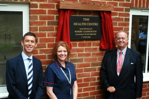 Lord Wandsworth College headteacher Adam Williams (left) and senior nurse Lindsey Scott with Robert Hannington, chairman of the governors at the unveiling of the new health centre plaque
