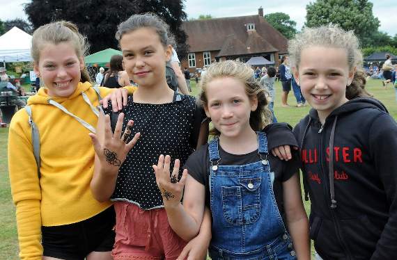 Don’t worry mum... these tattoos will come out in the wash – young girls having fun at Witley Village Fair (HD26-149-18 Pictures by RUTH MARSHALL