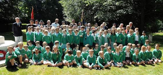 Liphook Junior School pupils gathered at the Bramshott Canadian War Memoriall at St Mary’s Church during the Canada Day service last week (LD27-115-18). Pictures by KATIE HILL