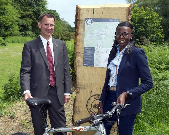 Jeremy Hunt and Donna Fraser by one of the trail marker posts (HD25-358-18)