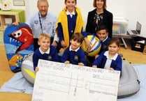 Pupils buoyant after RNLI cheque handover