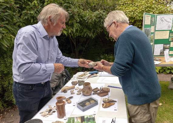 David Allen, of the Hampshire Cultural Trust, assessing a find from John Perrin. Picture order no: AD35-145-18