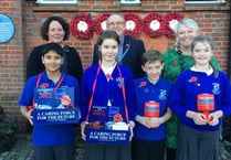 Camelsdale pupils and Grayshott scouts promoting poppies