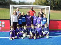 Youngsters from William Cobbett Primary School are joined by Aldershot Town footballer Karleigh Osborne at the unveiling of the new artificial pitch. Picture order no: FD42-34-18