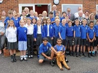 Pupils and guests including Camelsdale’s mascot Humphrey the camel celebrating the school’s new cafe’s opening (HD39-08-18)