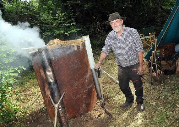 Ian Plumer stoking up the furnace that dates back to the 1600s (HD39-94-18)