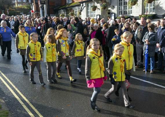 Brownies in their bright yellow tops taking part in the Remembrance parade from St Bartholomew’s Church to the War Memorial in the High Street (HD47-456-18)
