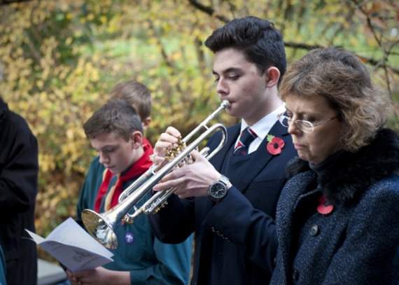Bugler Peter Hindson playing The Last Post at Bramshott War Memorial (LD47-382-18)