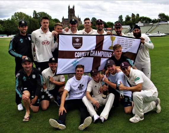 The jubilant Surrey side celebrate clinching the County Championship Division One title with a three-wicket win against Worcestershire. PIC: MARK SANDOM