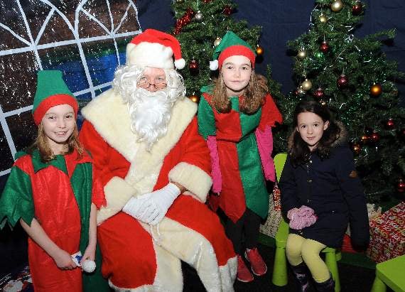 Santa – aided by his little helpers – was on hand at the Beacon Hill Christmas lights switch on to check whether the boys and girls from the village have been good this year (HD49-25-18). Picture by KATIE HILL