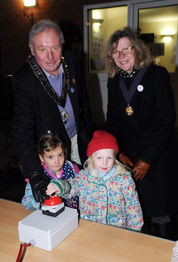 The youngest pupils from Beacon Hill Primary School throw the switch to turn on the village’s Christmas Lights watched by the mayor and mayoress of Haslemere
