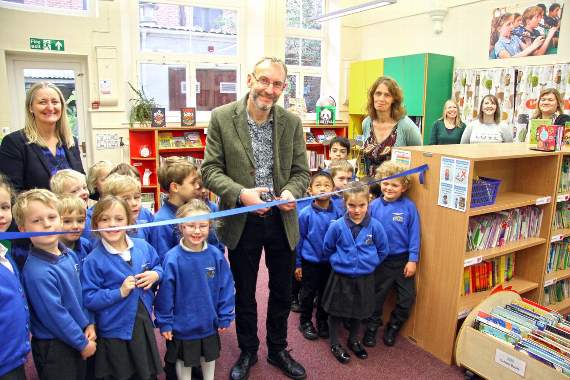 Tom Easton cuts the ribbon to open officially the newlook library at St Andrew's School in Farnham