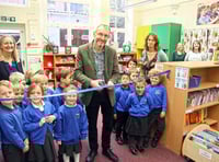 Tom Easton cuts the ribbon to open officially the newlook library at St Andrew's School in Farnham